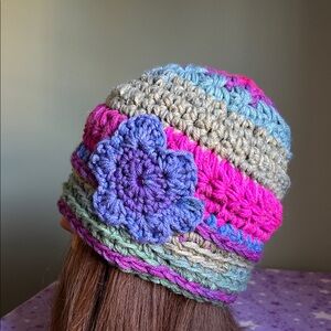 Handmade Multicolor Crochet Beanie with Purple Flower Accent medium acrylic